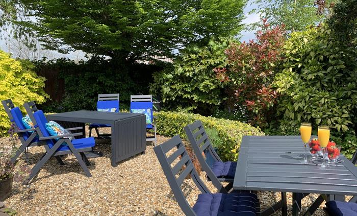 Our secluded garden is a delightful, peaceful space to spend time and relax with a book and how about a cool drink from the bar.  There are several se